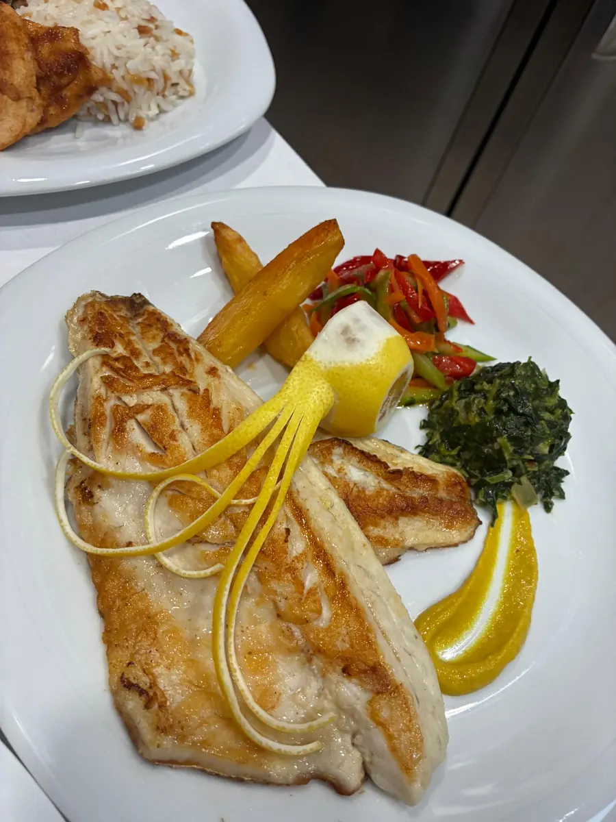 Sea bream fillet served for lunch on a yacht