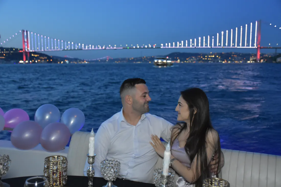 Anniversary balloons and candles on a yacht deck