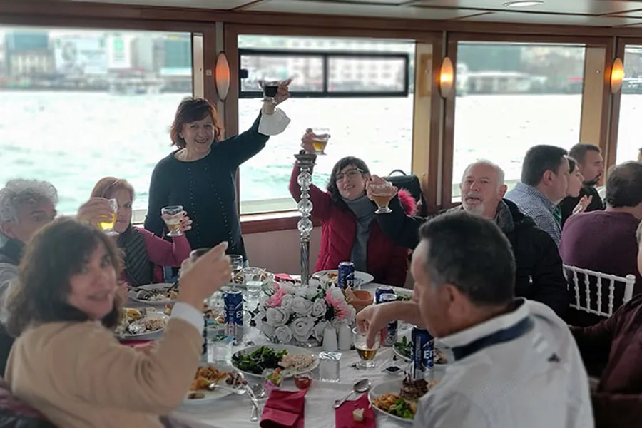 Group photo on the open deck of the lunch cruise