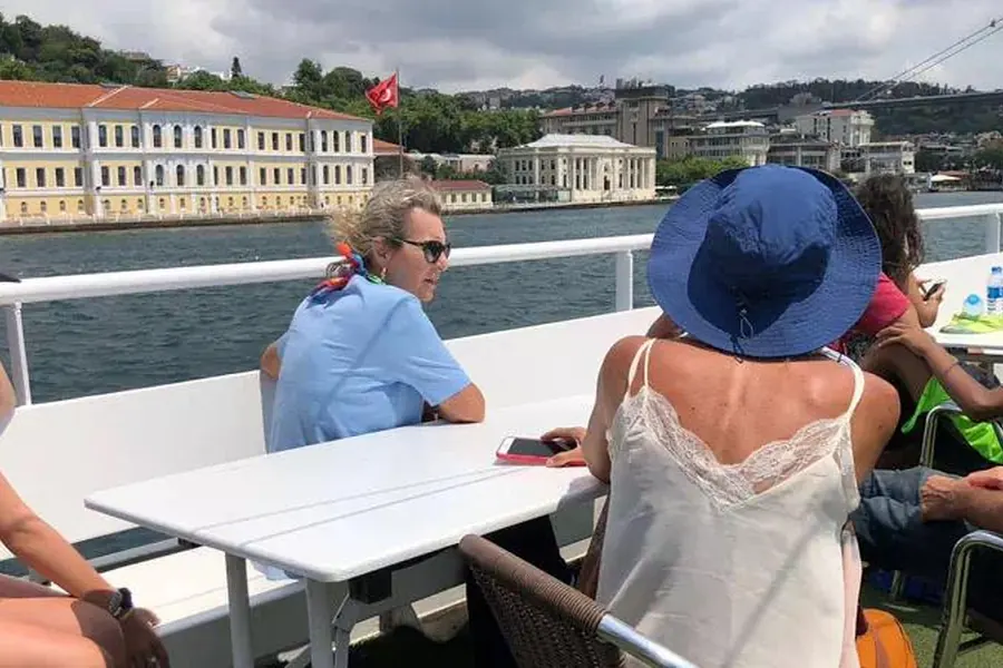 Guests at a deck table on the Bosphorus