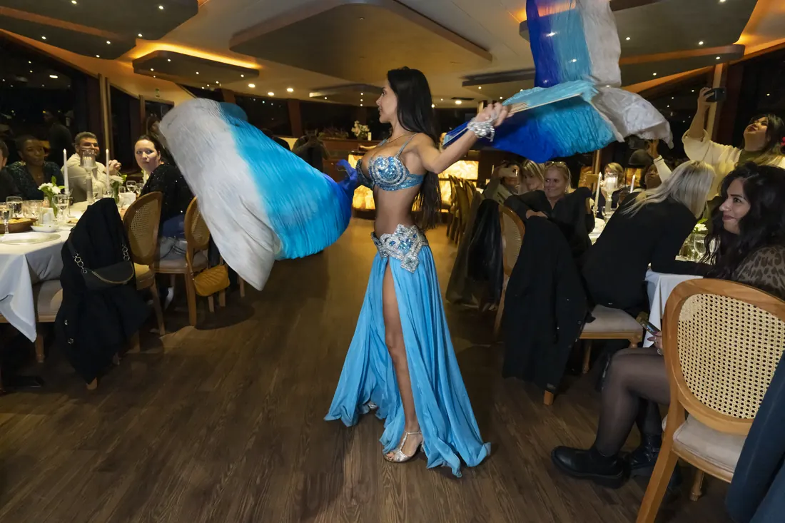 Belly dancer performing at a gala dinner on a yacht