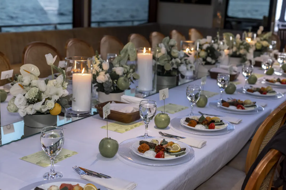 Gala table decorated with white flowers and candles