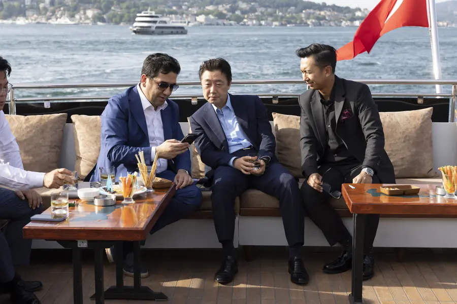 Executives on the deck of a yacht