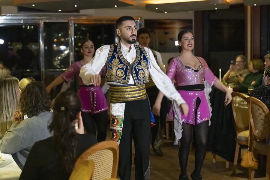 Turkish folk dancers performing on a yacht