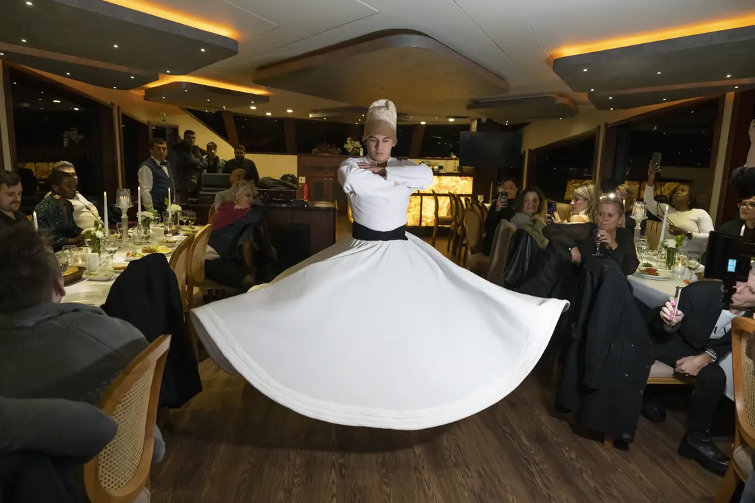 Whirling dervish show at a corporate dinner on a yacht