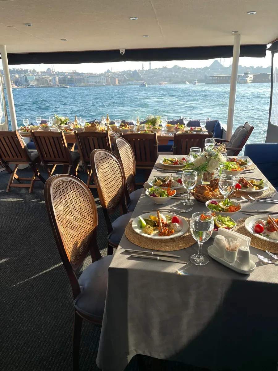 Dinner table on a yacht deck with a Bosphorus view