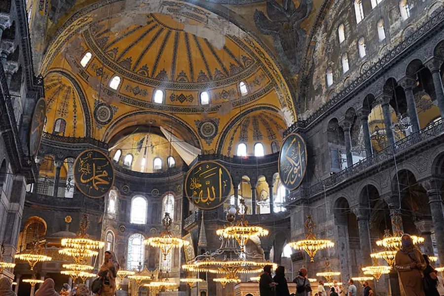 Chandeliers and arches inside Hagia Sophia
