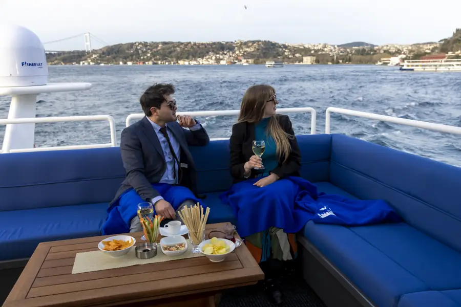 Guests on the upper deck of a yacht