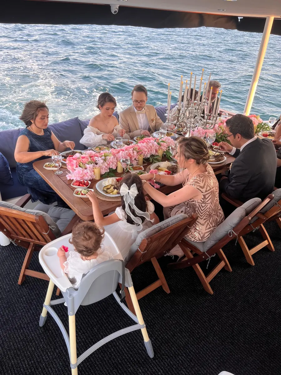 Family birthday lunch with flowers on a private yacht