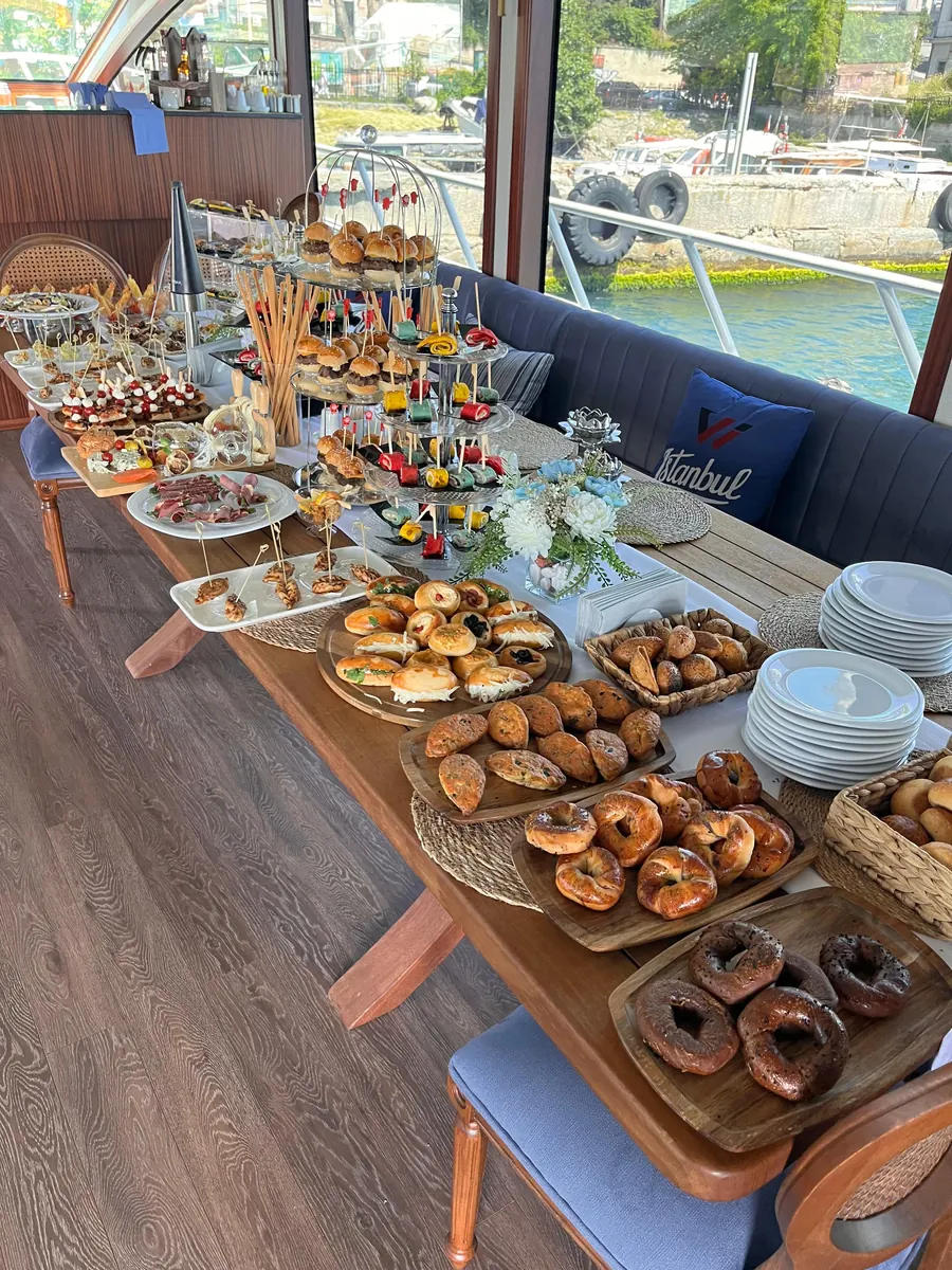 Pastries and sweets laid out in a yacht saloon