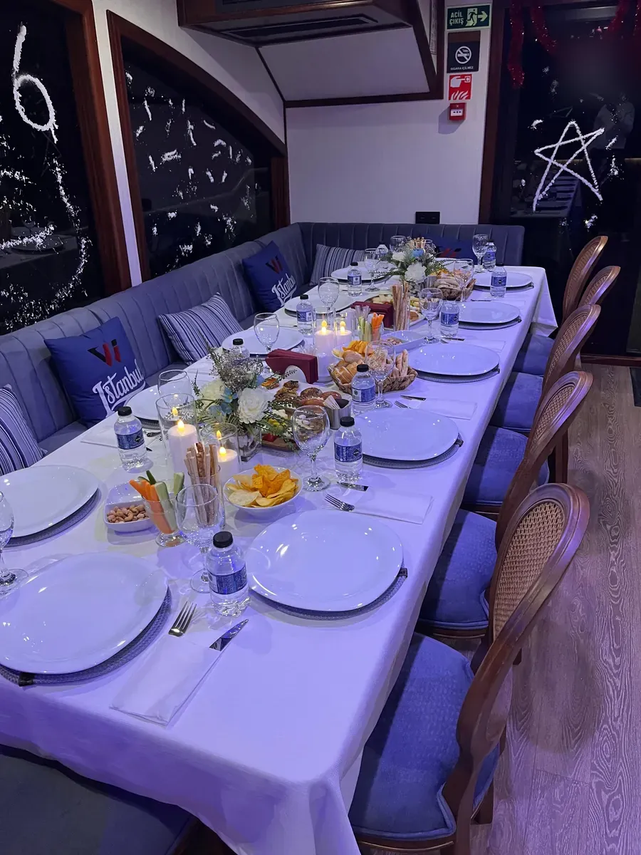 New Year's Eve dinner table with candles on a private yacht