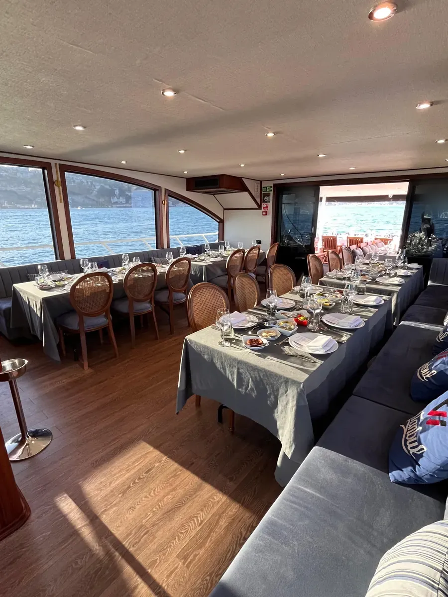 Yacht saloon set for dinner