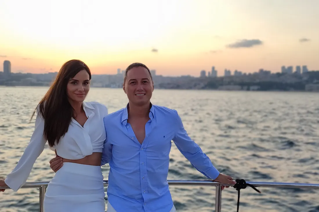 Couple on a yacht on the Bosphorus at golden hour