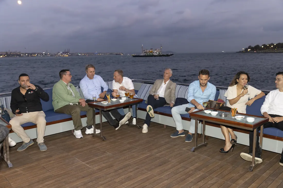 Team in the lounge area on the deck of a yacht
