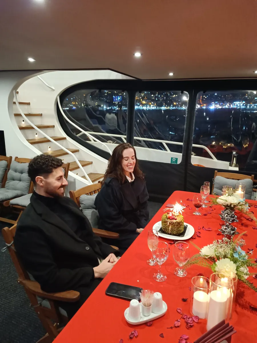 Red romantic table in a yacht saloon