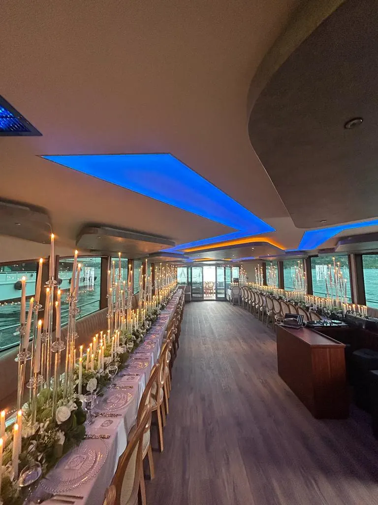 Long reception table in a yacht saloon