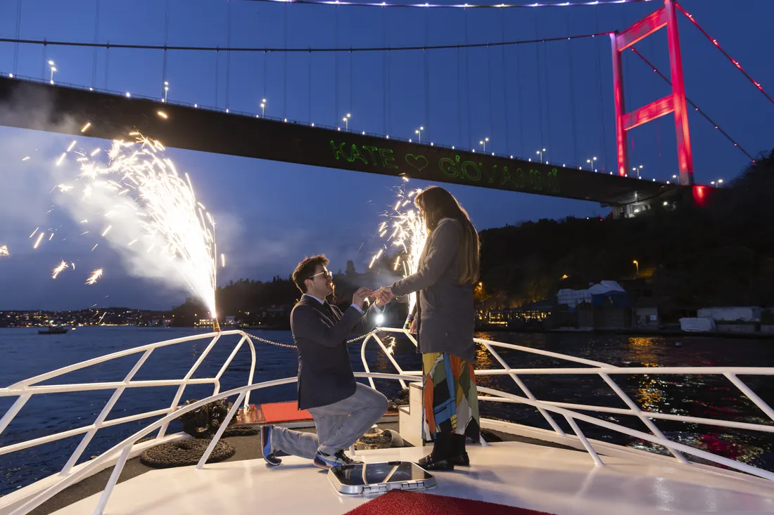 Marriage proposal with sparklers under the Bosphorus Bridge