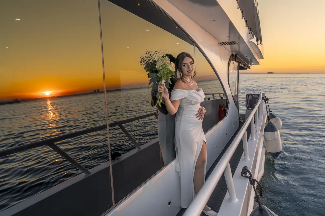 Bride on a yacht deck at sunset on the Bosphorus