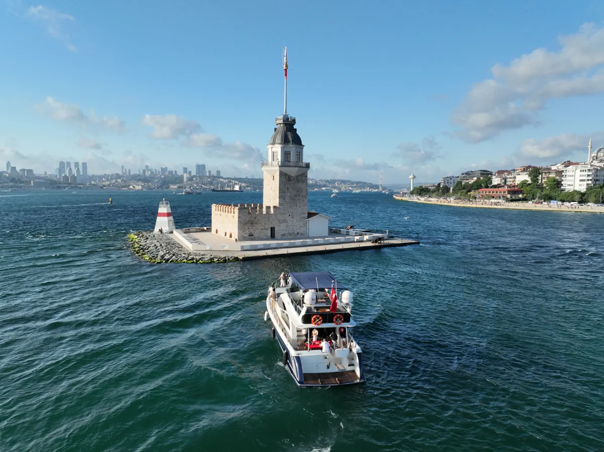 Azure yacht by the Maiden's Tower