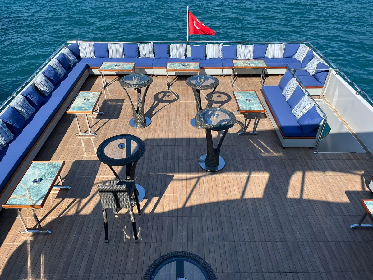 Flybridge with tables on the Crescent Star yacht